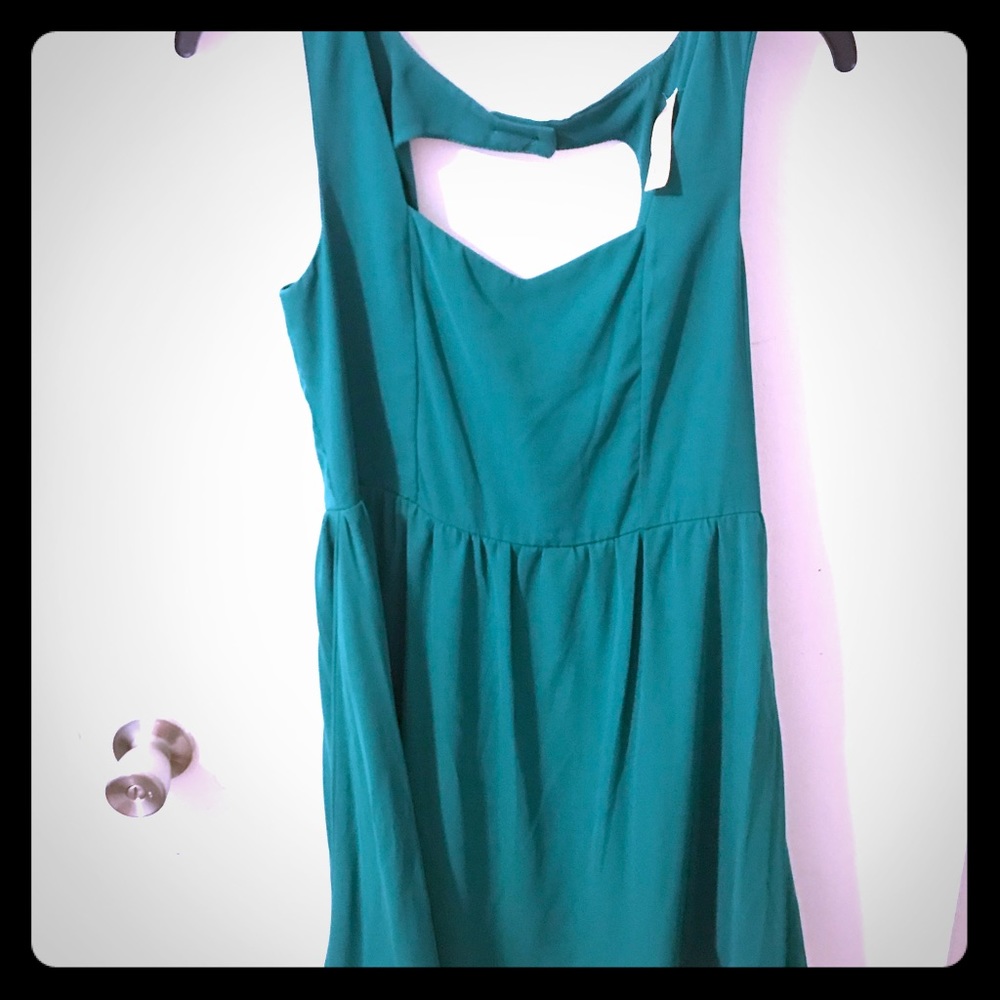 Classy turquoise dress with fun back!
